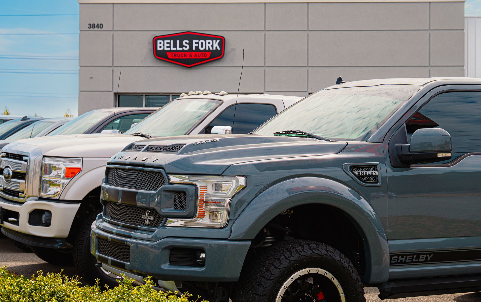 Bells Fork Truck & Auto storefront with trucks on the lot in Greenville, NC